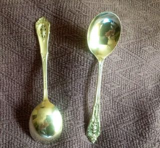 Four (4) Wallace Rosepoint Soup Spoons. photo
