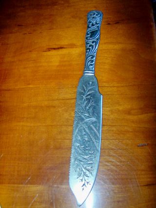 1891 Stratford Silver Plate Cake Knife/saw W/ Scrolled Handle & Decorative Blade photo