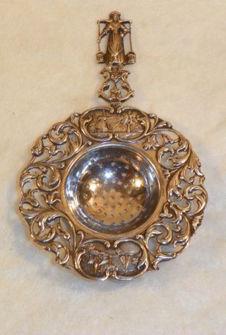 Dutch Tea Strainer.  800/1000 Sterling Silver.  Circa 1920. photo