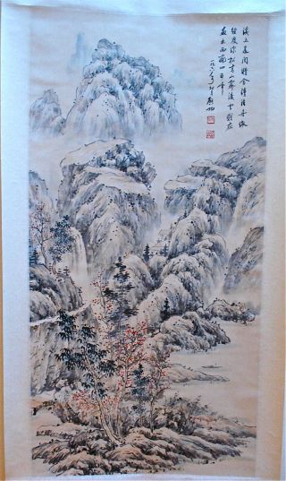 Chinese Scroll Painting Of A Mountain Scene photo