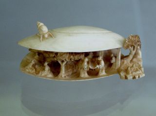 Ox Bone Chinese Shell,  With Carved Chinese Village Inside With Trees And People. photo