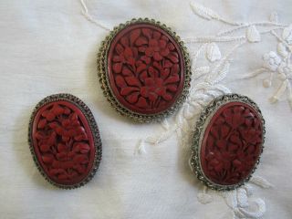 Three Antique Chinese Carved Cinnabar Dress Clips,  Filigree Settings,  One photo