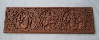 Attractive Carved Wood Panel With 3 Roundels Of Indian Dieties photo