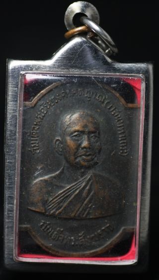 Old Dark Copper Thai Monk Medallion In Casing photo