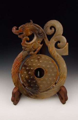 One Dragon Shaped Jade Carving With Disk Design photo