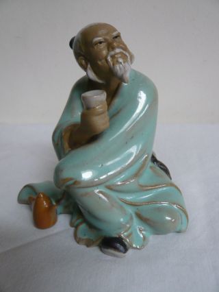 Vintage Chinese Mudman Figurine.  Wise Man With Cup.  ' 57 China ' Mark.  Glazed photo