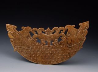 One Carved Jade Huang With Pattern photo