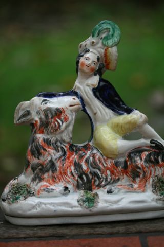 19th C.  Staffordshire Of The Seated Male Figure On The Bearded Goat photo