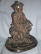 Antique Metal Spelter Of Fish Monger With Horn And Knapsack On Oval Base Metalware photo 1