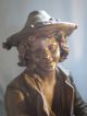 Antique Metal Spelter Of Fish Monger With Horn And Knapsack On Oval Base Metalware photo 2
