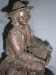 Antique Metal Spelter Of Fish Monger With Horn And Knapsack On Oval Base Metalware photo 3