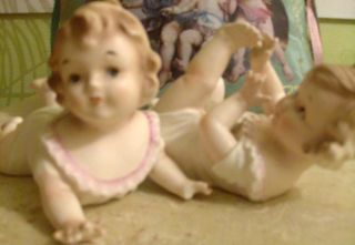 Pair Of Vintage Piano Babies In photo