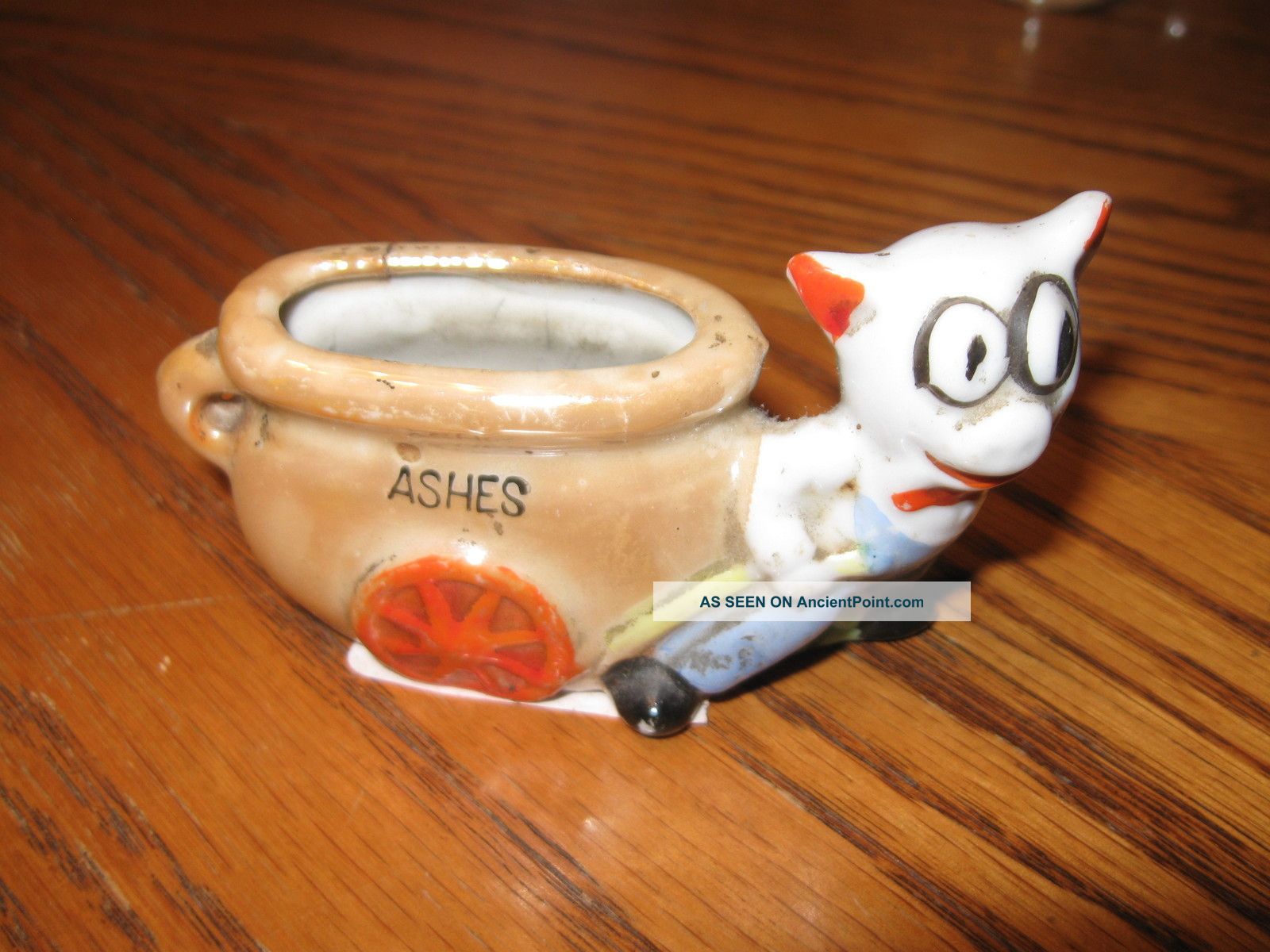 Porcelain Figurine Pig With Vase On Wheels Ashes Figurines photo