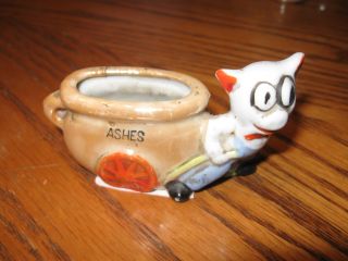 Porcelain Figurine Pig With Vase On Wheels Ashes photo