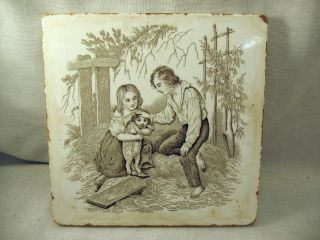 A Vintage Minton China Works Decorative Tile / Trivet - Girl And Boy With Dog photo