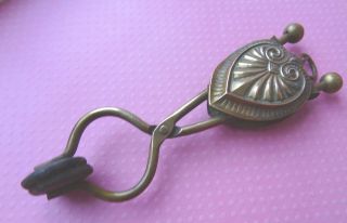 Antique Brass,  Hang Type Skirt Lifter Tool,  Ornate Heart Desogn photo