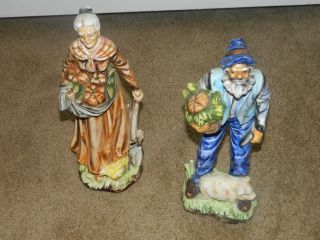 Antique Porcelain Figurines Man And Woman Farmers. photo