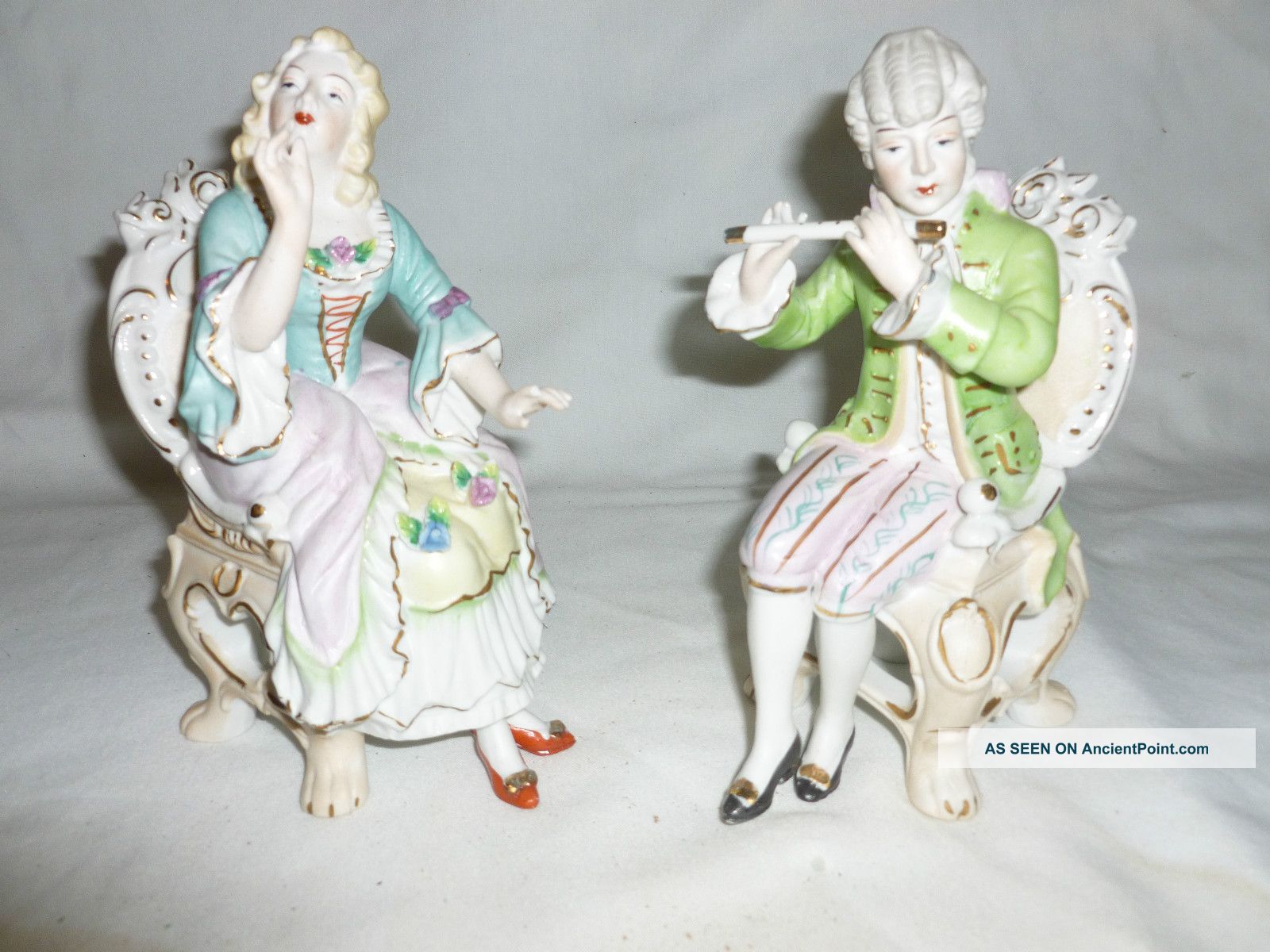 Set Of Bisque Figurines,  Man Playing Flute,  Entertaining The Woman. Figurines photo