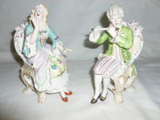 Set Of Bisque Figurines,  Man Playing Flute,  Entertaining The Woman. photo