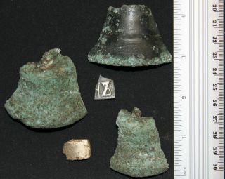 Ancient Old Broken Bronze Bell Fragments photo
