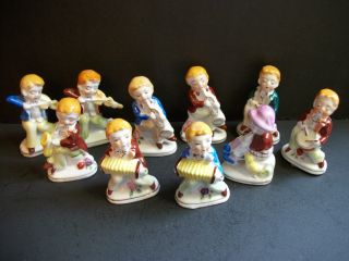 Group Of 10 Occupied Japan Figurines/musicians/violins/drums/horns/accordians/ex photo