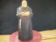 A Priest With Bible Or Some Religious Word.  View For Own Decision Making. Carved Figures photo 2