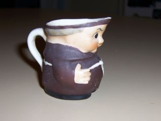 Small Antique Porcelain Pitcher In The Shape Of An Old Friar Or Monk photo