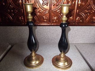 Antique Pair Of Brass And Black Candlesticks photo