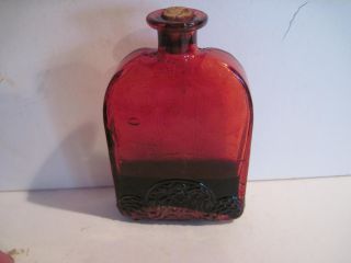 Old Antique Red Bottle With 1/4 Full Of Unidentified Liquid.  Fancy Designs,  Look photo