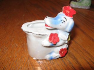 Porcelain Figurine Dog With Vase photo