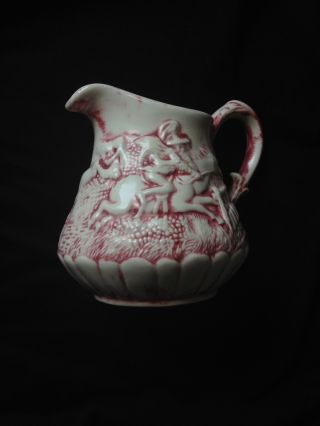 Decorative Cream Pitcher With Ornate Image.  It Is A Family Heirloom. photo