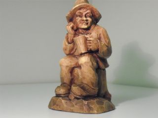 Man Setting On Tree Stump  