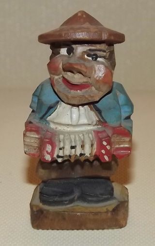 Mini Carved Wood Man With Accordian Squeeze Box photo
