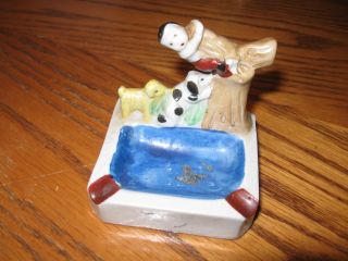 Porcelain Figurine Boy In Tree With Two Dogs photo
