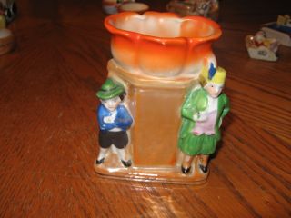 Porcelain Figurine Two Men By Pole Flower photo