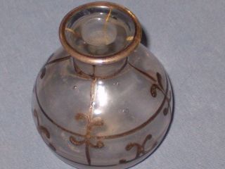 Small Old Bottle Cool Design Possibly For Perfume Or Powder Makeup photo