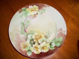 Vintage Handpainted Plate With Yellow Floral Design With Green Leaves On A Vine. photo