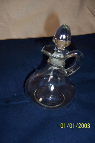 Vintage Clear Glass Perfume Bottle With Glass Stopper That Goes In Top. photo