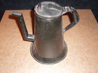 An Undecorated Antique Toleware Watering Can photo