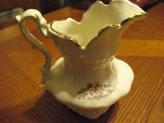 Floral Cream Colored Pitcher,  With Gold Trim Around The Top, photo
