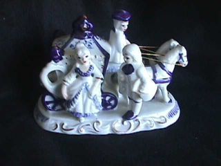 Porcelain Stage Coach With Colonial Figures photo
