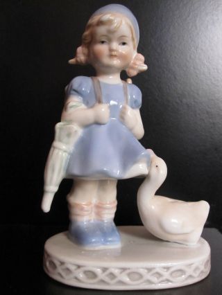 Pottery Statue Girl With A Goose photo