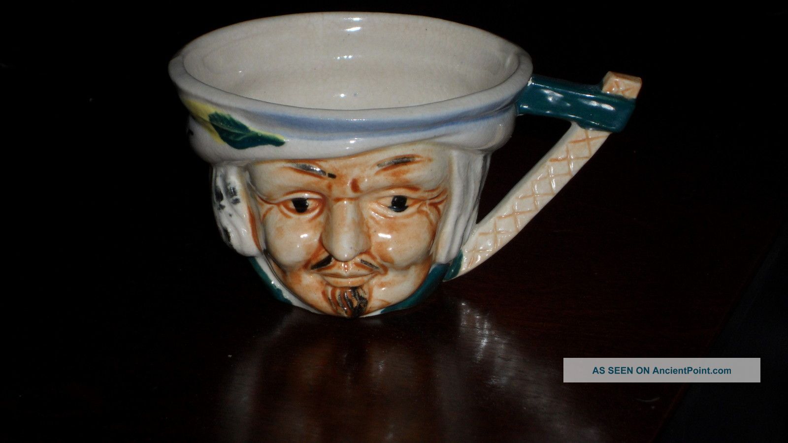 Antique Cup With Face Of An Old Man Cups & Saucers photo