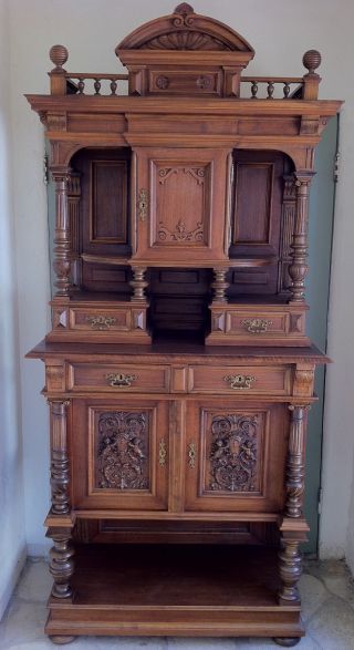 Antique Hutch With Elegant Carvings And Details photo
