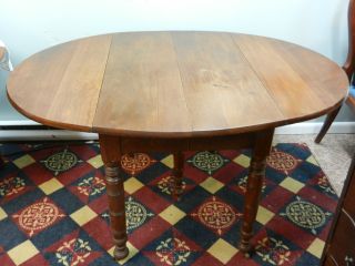 Oval Solid Walnut Drop Leaf Table With Center Leaf And Fifth Leg photo