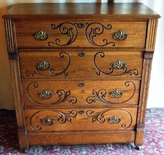 Antique Tall Four Drawer Oak Chest/ Dresser With Engraved Scroll Accents photo
