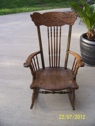 Vintage Elegantly Carved Solid Wooden Rocking Chair photo
