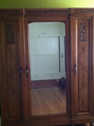 This Antique Armoire Has Lots Of Storage - Great For Extra Closet Space photo