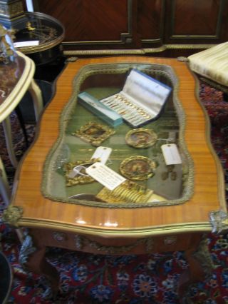 Wood With Open Glass And Bronze Decoration Coffee Table photo