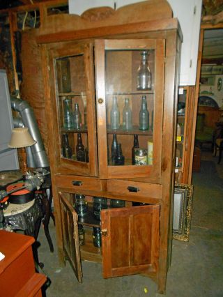 Antique/primitive 4 - Door One - Piece Wooden Cupboard photo